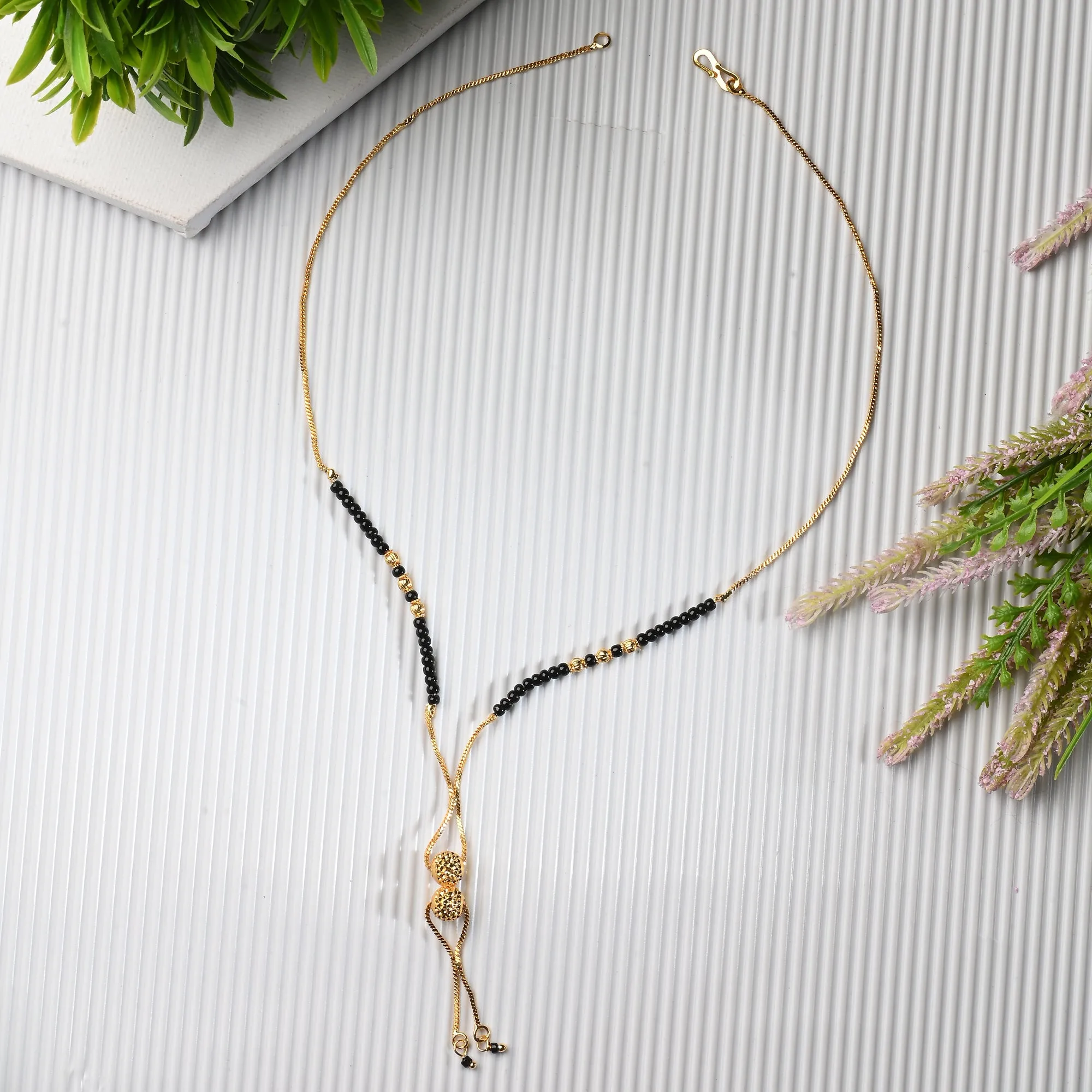 AanyaCentric Gold-plated Jewelry Combo: Elegant Short Mangalsutra, Finger Ring, and American Diamond Earrings Set